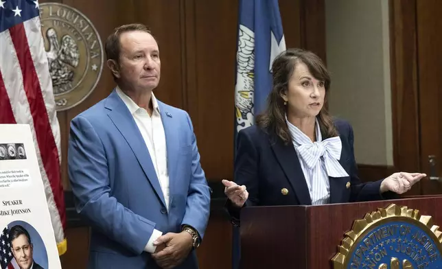 Louisiana Attorney General Liz Murrill, right, speaks alongside Louisiana Gov. Jeff Landry during a press conference regarding the Ten Commandments in schools Monday, Aug. 5, 2024, in Baton Rouge, La. Murrill announced on Monday that she is filing a brief in federal court asking a judge to dismiss a lawsuit seeking to overturn the state’s new law requiring that the Ten Commandments be displayed in every public school classroom. (Hilary Scheinuk/The Advocate via AP)