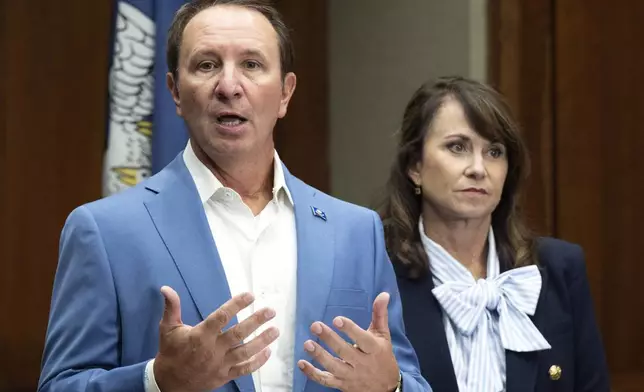 Louisiana Gov. Jeff Landry speaks alongside Louisiana Attorney General Liz Murrill during a press conference regarding the Ten Commandments in schools Monday, Aug. 5, 2024, in Baton Rouge, La. Murrill announced on Monday that she is filing a brief in federal court asking a judge to dismiss a lawsuit seeking to overturn the state’s new law requiring that the Ten Commandments be displayed in every public school classroom. (Hilary Scheinuk/The Advocate via AP)