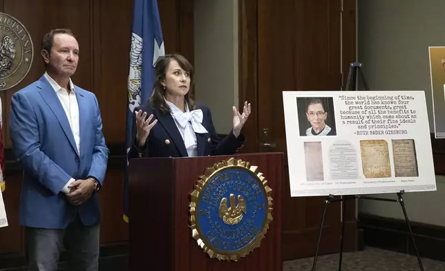 Louisiana Attorney General Liz Murrill speaks alongside Louisiana Gov. Jeff Landry during a press conference regarding the Ten Commandments in schools Monday, Aug. 5, 2024, in Baton Rouge, La. Murrill announced on Monday that she is filing a brief in federal court asking a judge to dismiss a lawsuit seeking to overturn the state’s new law requiring that the Ten Commandments be displayed in every public school classroom. (Hilary Scheinuk/The Advocate via AP)