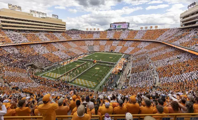 FILE - Tennessee players run onto the field at Neyland Stadium before an NCAA college football game between Tennessee and Texas A&amp;M Saturday, Oct. 14, 2023, in Knoxville, Tenn. (AP Photo/Wade Payne, File)