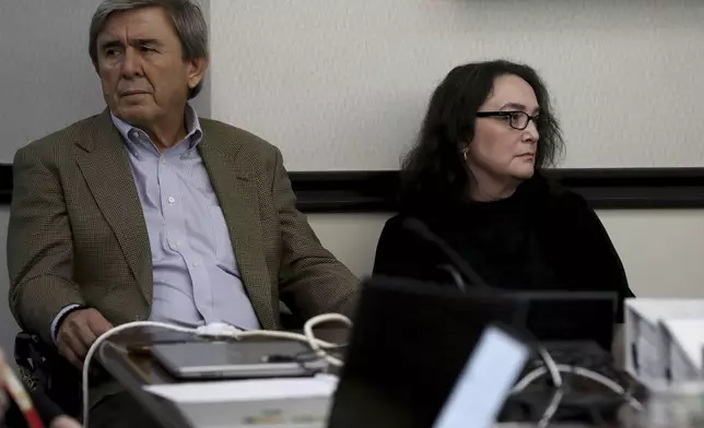 Antonios Pagourtzis, left, and Rose Marie Kosmetatos, parents of accused school shooter Dimitrios Pagourtzis, await the start of the civil trial against them in Galveston County Court No. 3 Judge Jack Ewing's courtroom at the Galveston County Courthouse in Galveston, Texas on Wednesday, July 31, 2024. (Jennifer Reynolds/The Galveston County Daily News via AP, Pool)