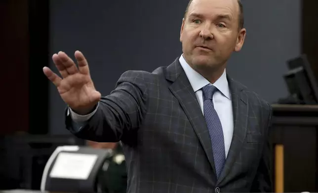 Attorney Clint McGuire, representing several families of victims of the 2018 Santa Fe High School shooting gives his opening statement in the civil trial against Antonios Pagourtzis and Rose Marie Kosmetatos, parents of accused school shooter Dimitrios Pagourtzis, on Wednesday, July 31, 2024, in Galveston County Court No. 3 Judge Jack Ewing's courtroom at the Galveston County Courthouse in Galveston, Texas. (Jennifer Reynolds/The Galveston County Daily News via AP, Pool)