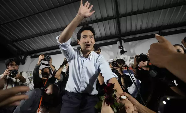 FILE - Former leader of Move Forward Party, Pita Limjaroenrat, center, shakes hands with his supporters at the party's headquarters in Bangkok, Thailand, on Aug. 7, 2024. (AP Photo/Sakchai Lalit, File)