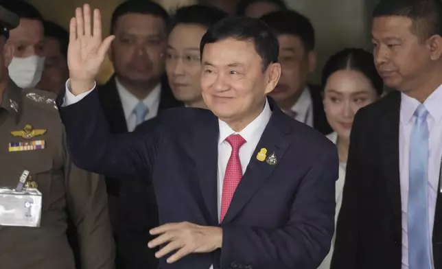 FILE - Former Prime Minister Thaksin Shinawatra, center, arrives at Don Muang airport in Bangkok, Thailand, on Aug. 22, 2023. (AP Photo/Sakchai Lalit, File)