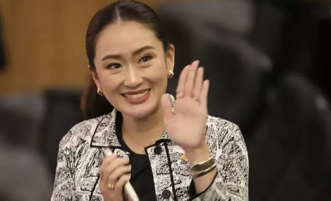 Leader of Pheu Thai Party, Paetongtarn Shinawatra, daughter of Thailand's former Prime Minister Thaksin Shinawatra, wave before press conference in Bangkok, Thailand, Thursday, Aug. 15, 2024. (AP Photo/Sakchai Lalit)