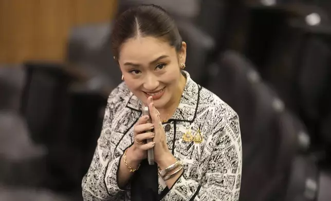 Leader of Pheu Thai Party, Paetongtarn Shinawatra, daughter of Thailand's former Prime Minister Thaksin Shinawatra, smiles before press conference in Bangkok, Thailand, Thursday, Aug. 15, 2024. (AP Photo/Sakchai Lalit)