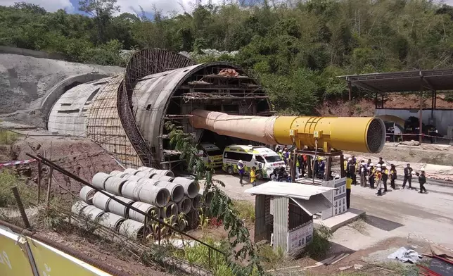 In this photo released by the State Railway of Thailand, ambulances are prepared Friday, Aug. 30, 2024, to carry away bodies of two workers who had been trapped in a collapsed tunnel in Nakhon Ratchasima province, Thailand, that is part of the Thai-Chinese high-speed railway construction site. (State Railway of Thailand via AP)