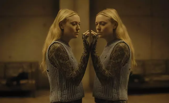 This image released by Warner Bros. Pictures shows Dakota Fanning in a scene from "The Watchers." (Warner Bros. Pictures via AP)