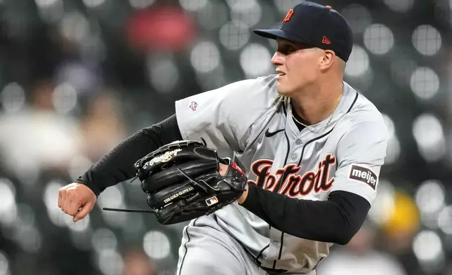 Detroit Tigers starting pitcher Ty Madden follows through with a pitch in his Major League debut during the third inning of a baseball game against the Chicago White Sox on Monday, Aug. 26, 2024, in Chicago. (AP Photo/Charles Rex Arbogast)