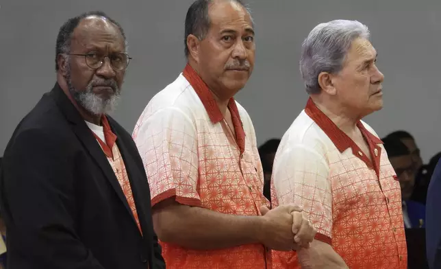 Vanuatu Prime Minister Charlot Salwai, from left, Niue Prime Minister Dalton Tagelagi and New Zealand Foreign Minister Winston Peters attend the opening of the annual Pacific Islands Forum leaders meeting in Nuku'alofa, Tonga, Monday, Aug. 26, 2024. (AP Photo/Charlotte Graham-McLay)