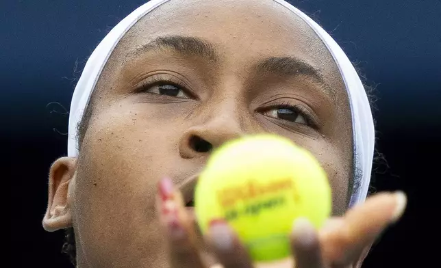 United States' Coco Gauff tosses to serve to China's Yafan Yang during the National Bank Open tennis tournament in Toronto , Thursday, Aug. 8, 2024. (Frank Gunn/The Canadian Press via AP)