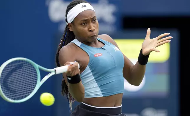 United States' Coco Gauff hits a return to China's Yafan Yang during the National Bank Open tennis tournament in Toronto , Thursday, Aug. 8, 2024. (Frank Gunn/The Canadian Press via AP)