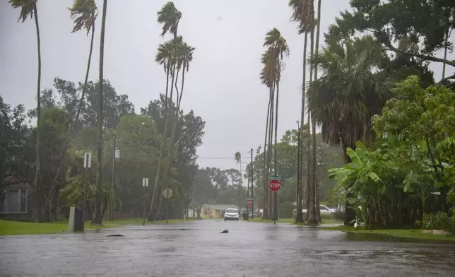 Floodwaters cover parts of the Shore Acres neighborhood of St. Petersburg, Fla., as a result of Tropical Storm Debby Sunday afternoon, Aug. 4, 2024. (Dylan Townsend/Tampa Bay Times via AP)