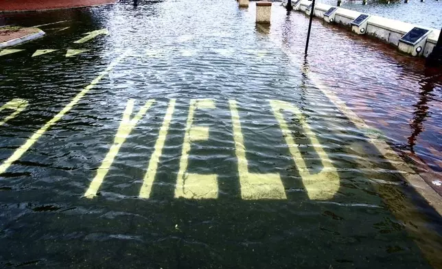 Flooding from Tropical Storm Debby covers the street near the City Dock in Annapolis, Md., on Friday, Aug. 9, 2024 (Kaitlin Newman/The Baltimore Banner via AP)