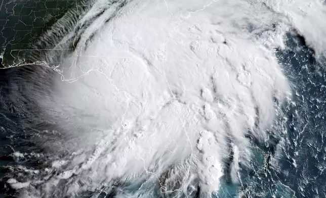 This GOES-16 GeoColor satellite image taken at 8:11 a.m. EDT and provided by National Oceanic and Atmospheric Administration (NOAA) shows Hurricane Debby, a Category 1 storm over northern Florida, Monday, Aug. 5, 2024. (NOAA via AP)