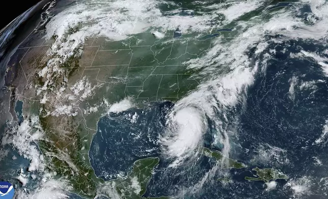 This satellite image provided by NOAA shows Tropical Storm Debby as it moves through the Gulf of Mexico toward Florida on Sunday, Aug. 4, 2024. (NOAA via AP)