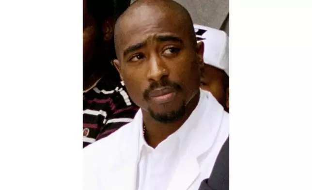 FILE - Rapper Tupac Shakur attends a voter registration event in South Central Los Angeles, Aug. 15, 1996. (AP Photo/Frank Wiese, File)