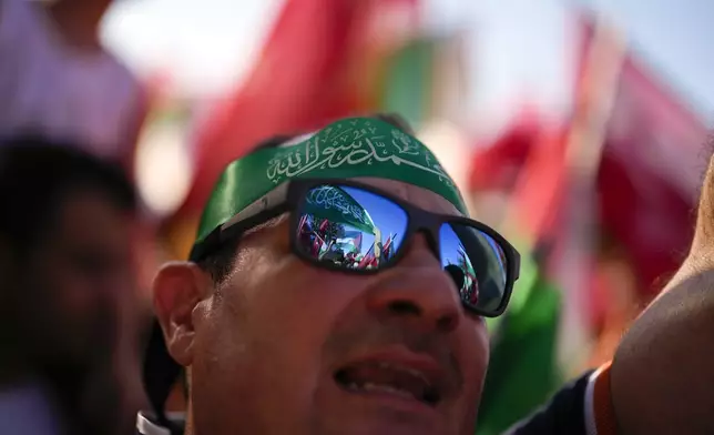 Demonstrators chant slogans while holding Palestinian and Turkish flags during a rally in support of Palestinians in Gaza, in Istanbul, Turkey, Saturday, Aug. 3, 2024. (AP Photo/Khalil Hamra)