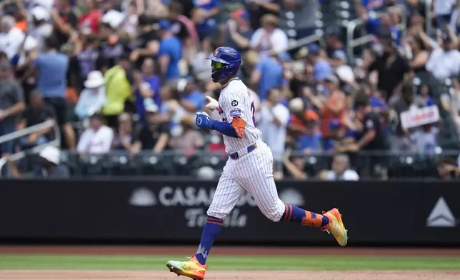 New York Mets' Mark Vientos reacts as he rounds the bases after hitting a two-run homer during the second inning of a baseball game against the Minnesota Twins at Citi Field, Wednesday, July 31, 2024, in New York. (AP Photo/Seth Wenig)