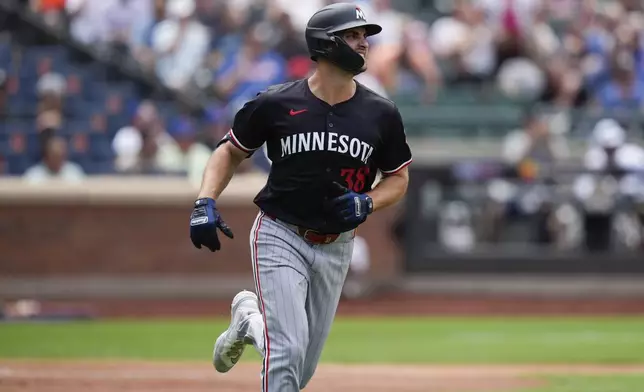 Minnesota Twins' Matt Wallner runs up the first baseline after his two-run home run in the third inning of a baseball game against the New York Mets at Citi Field, Wednesday, July 31, 2024, in New York. (AP Photo/Seth Wenig)