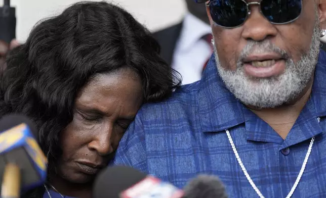 RowVaughn Wells rests on her husband's shoulder Rodney Wells, the parents of Tyre Nichols, during a news conference after a former Memphis Police Department officer pleaded guilty to civil rights violations in the 2023 fatal beating of their son, Friday, Aug. 23, 2024, in Memphis, Tenn. (AP Photo/George Walker IV)