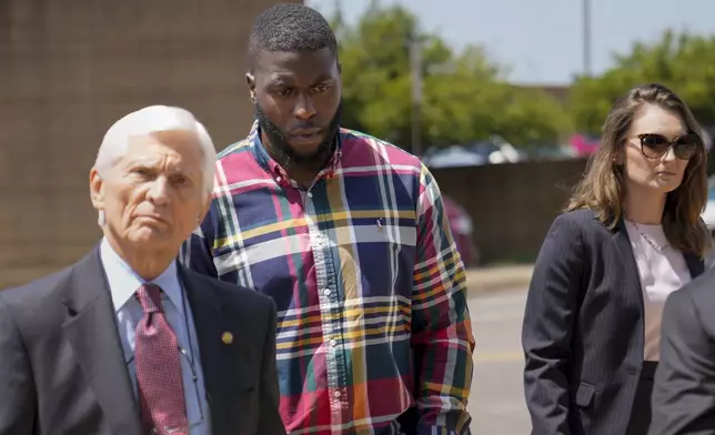 Emmitt Martin III, a former Memphis Police Department officer, second from left, accused of killing Tyre Nichols, walks into federal court Friday, Aug. 23, 2024, in Memphis, Tenn. (AP Photo/George Walker IV)