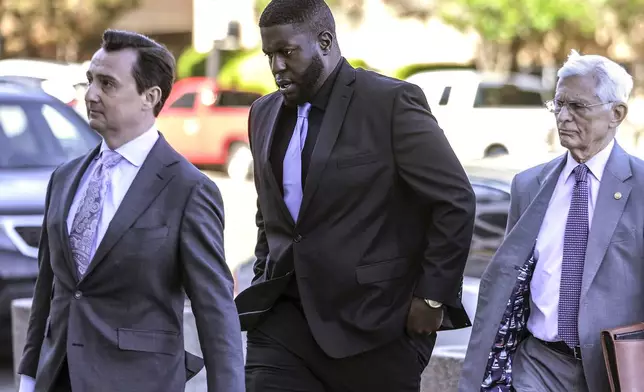 FILE - Emmitt Martin III, a former Memphis Police Department officer accused of killing Tyre Nichols, walks into federal court with attorney in Memphis, Tenn., on April 4, 2024. (Patrick Lantrip/Daily Memphian via AP, File)