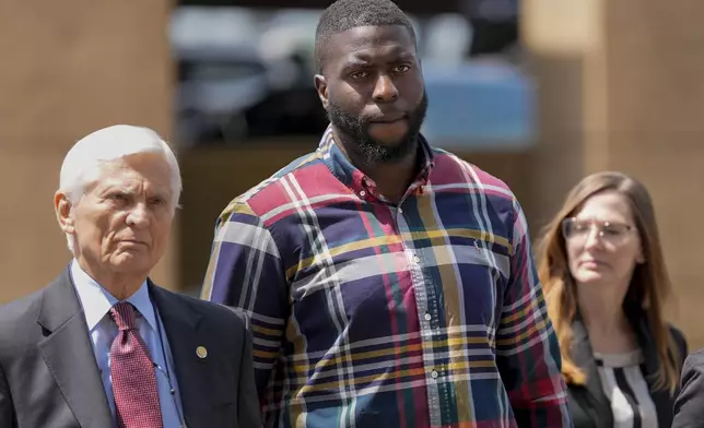 Emmitt Martin III, a former Memphis Police Department officer, second from left, accused of killing Tyre Nichols, walks into federal court Friday, Aug. 23, 2024, in Memphis, Tenn. (AP Photo/George Walker IV)