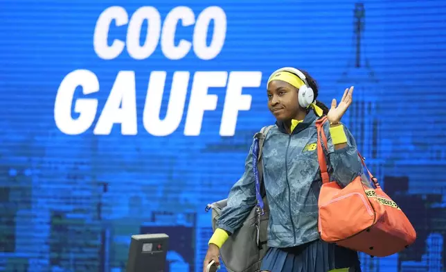 Coco Gauff, of the United States, waves as she walks onto the court before a second round match against Tatjana Maria, of Germany, of the U.S. Open tennis championships, Wednesday, Aug. 28, 2024, in New York. (AP Photo/Frank Franklin II)