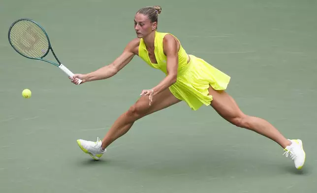 Marta Kostyuk, of Ukraine, returns a shot to Emma Navarro, of the United States, Marta Kostyuk, of Ukraine, during the third round of the U.S. Open tennis championships, Friday, Aug. 30, 2024, in New York. (AP Photo/Matt Rourke)