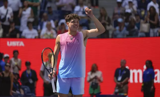 Ben Shelton, of the United States, reacts after defeating Dominic Thiem, of Austria, during the first round of the U.S. Open tennis championships, Monday, Aug. 26, 2024, in New York. (AP Photo/Seth Wenig)