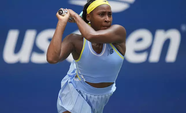 Coco Gauff, of the United States, returns a shot to Varvara Gracheva, of France, during the first round of the U.S. Open tennis championships, Monday, Aug. 26, 2024, in New York. (AP Photo/Seth Wenig)