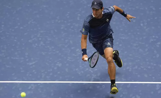 Mackenzie McDonald, of the United States, chases down a shot from Jannik Sinner, of Italy, during the first round of the U.S. Open tennis championships, Tuesday, Aug. 27, 2024, in New York. (AP Photo/Julia Nikhinson)