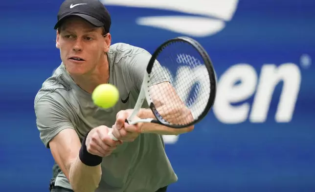 Jannik Sinner, of Italy, returns a shot to Mackenzie McDonald, of the United States, during the first round of the U.S. Open tennis championships, Tuesday, Aug. 27, 2024, in New York. (AP Photo/Kirsty Wigglesworth)