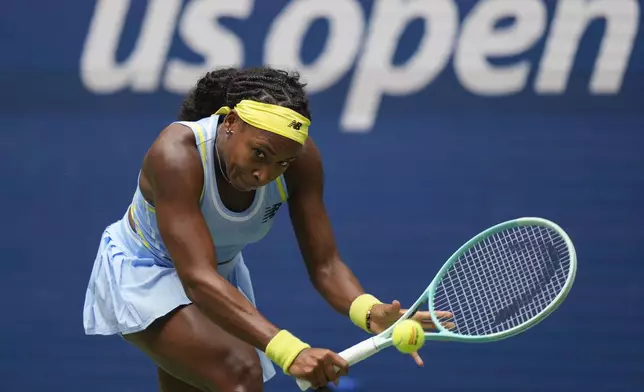 Coco Gauff, of the United States, returns a shot to Elina Svitolina, of Ukraine, during the third round of the U.S. Open tennis championships, Friday, Aug. 30, 2024, in New York. (AP Photo/Seth Wenig)