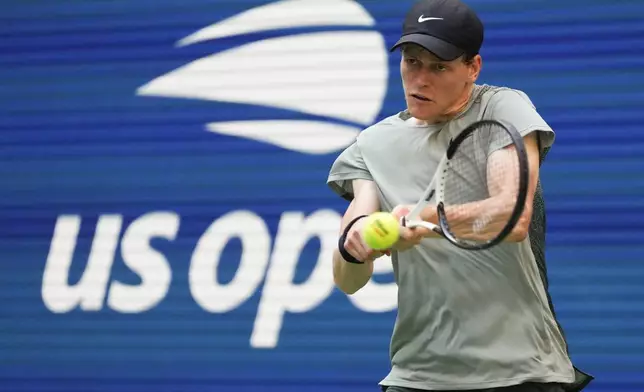 Jannik Sinner, of Italy, returns a shot to Mackenzie McDonald, of the United States, during the first round of the U.S. Open tennis championships, Tuesday, Aug. 27, 2024, in New York. (AP Photo/Kirsty Wigglesworth)