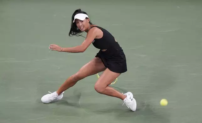 Priscilla Hon, of Australia, returns a shot to Aryna Sabalenka, of Belarus, during a first round match of the U.S. Open tennis championships, Monday, Aug. 26, 2024, in New York. (AP Photo/Frank Franklin II)