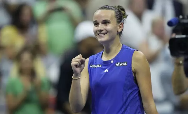 Clara Burel, of France, reacts against Sloane Stephens, of the United States, during a first round match of the U.S. Open tennis championships, Monday, Aug. 26, 2024, in New York. (AP Photo/Matt Rourke)