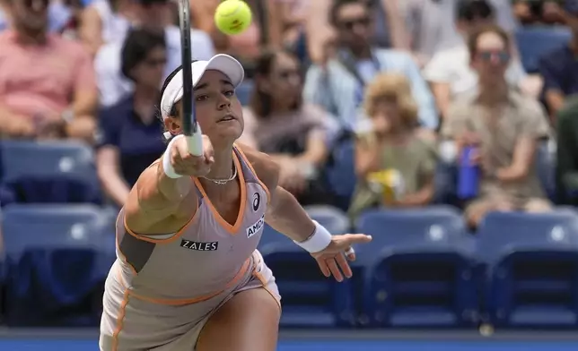 Caroline Dolehide, of the United States, returns a shot to Danielle Collins, of the United States, during the first round of the U.S. Open tennis championships, Tuesday, Aug. 27, 2024, in New York. (AP Photo/Seth Wenig)