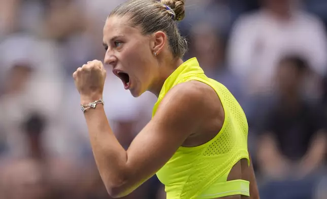 Marta Kostyuk, of Ukraine, reacts after scoring a point against Emma Navarro, of the United States, Marta Kostyuk, of Ukraine, during the third round of the U.S. Open tennis championships, Friday, Aug. 30, 2024, in New York. (AP Photo/Matt Rourke)