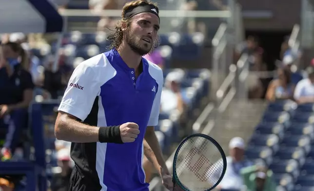 Stefanos Tsitsipas, of Greece, reacts after scoring a point against Thanasi Kokkinakis, of Australia,during the first round of the U.S. Open tennis championships, Tuesday, Aug. 27, 2024, in New York. (AP Photo/Pamela Smith)