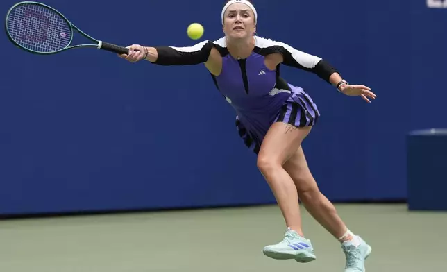 Elina Svitolina, of Ukraine, returns a shot to Coco Gauff, of the United States, during the third round of the U.S. Open tennis championships, Friday, Aug. 30, 2024, in New York. (AP Photo/Seth Wenig)