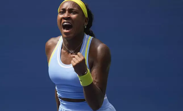 Coco Gauff, of the United States, reacts after scoring a point against Elina Svitolina, of Ukraine, during the third round of the U.S. Open tennis championships, Friday, Aug. 30, 2024, in New York. (AP Photo/Seth Wenig)