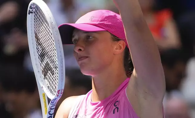 Iga Swiatek, of Poland, waves to fans after defeating Kamilla Rakhimova, during the first round of the U.S. Open tennis championships, Tuesday, Aug. 27, 2024, in New York. (AP Photo/Kirsty Wigglesworth)