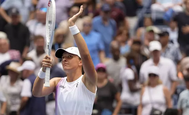 Iga Swiatek, of Poland, waves to the crowd after defeating Ena Shibahara, of Japan, during the second round of the U.S. Open tennis championships, Thursday, Aug. 29, 2024, in New York. (AP Photo/Julia Nikhinson)