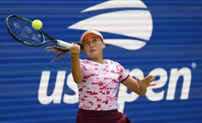 Kamilla Rakhimova, returns a shot to Iga Swiatek, of Poland, during the first round of the U.S. Open tennis championships, Tuesday, Aug. 27, 2024, in New York. (AP Photo/Kirsty Wigglesworth)