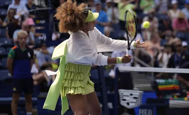 Naomi Osaka, of Japan, warms up before playing against Jelena Ostapenko, of Latvia, during the first round of the U.S. Open tennis championships, Tuesday, Aug. 27, 2024, in New York. (AP Photo/Seth Wenig)