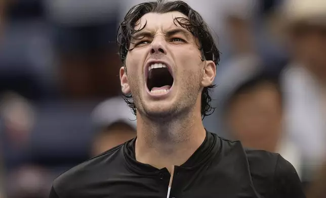 Taylor Fritz, of the United States, reacts after defeating Francisco Comesana, of Argentina, during the third round of the U.S. Open tennis championships, Friday, Aug. 30, 2024, in New York. (AP Photo/Matt Rourke)