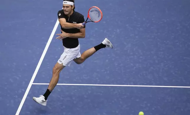 Taylor Fritz, of the United States, returns a shot to Francisco Comesana, of Argentina, during the third round of the U.S. Open tennis championships, Friday, Aug. 30, 2024, in New York. (AP Photo/Matt Rourke)