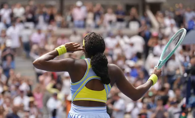 Coco Gauff, of the United States, motions to the crowd after defeating Elina Svitolina, of Ukraine, during the third round of the U.S. Open tennis championships, Friday, Aug. 30, 2024, in New York. (AP Photo/Seth Wenig)